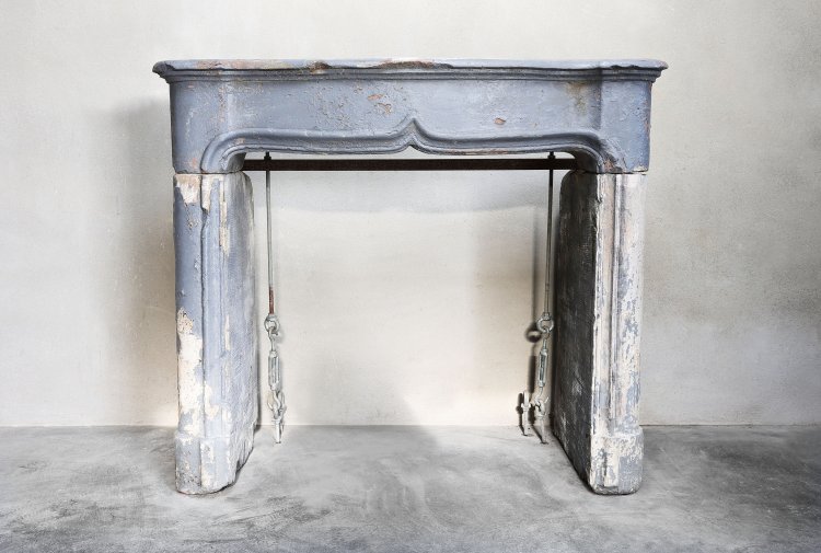 antique fireplace of french limestone