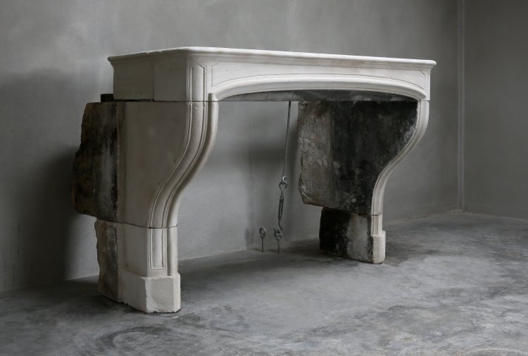 antique fireplace of french limestone