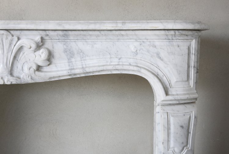 Louis XV fireplace of Carrara marble