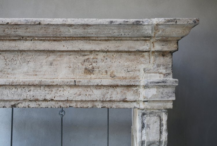 antique fireplace of french limestone