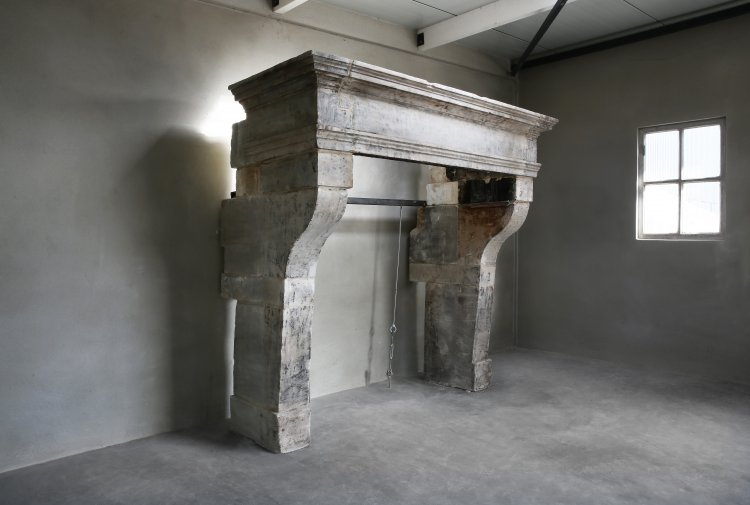 19th century fireplace of limestone