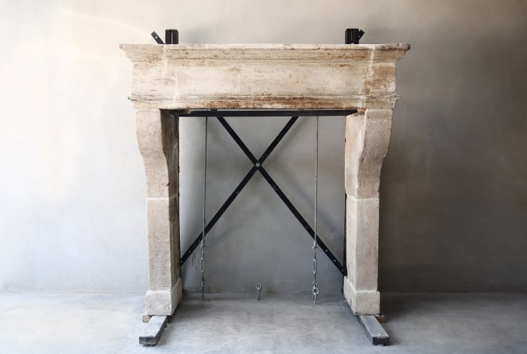 antique fireplace of french limestone