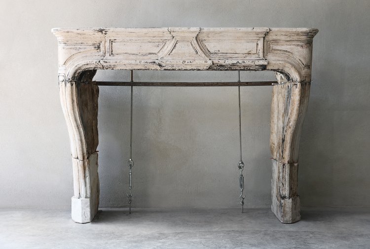 antique fireplace of limestone