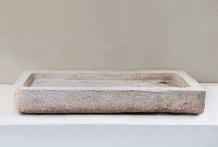 antique sink of burgundy stone