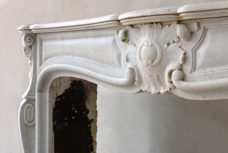 antique fireplace of carrara marble