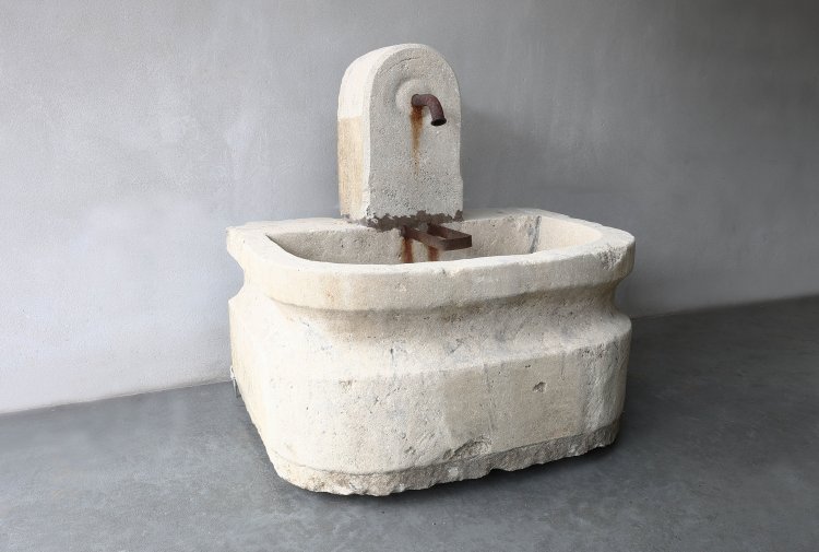 old fountain of french limestone
