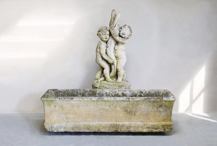 old trough and sculpture of french limestone