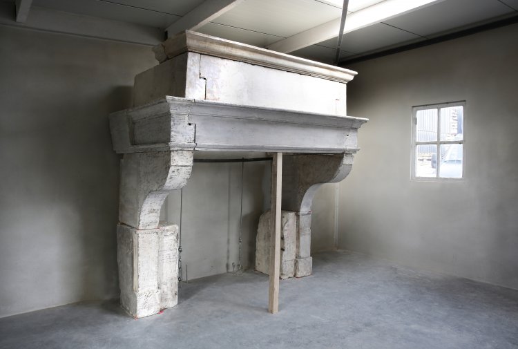 old french fireplace of limestone