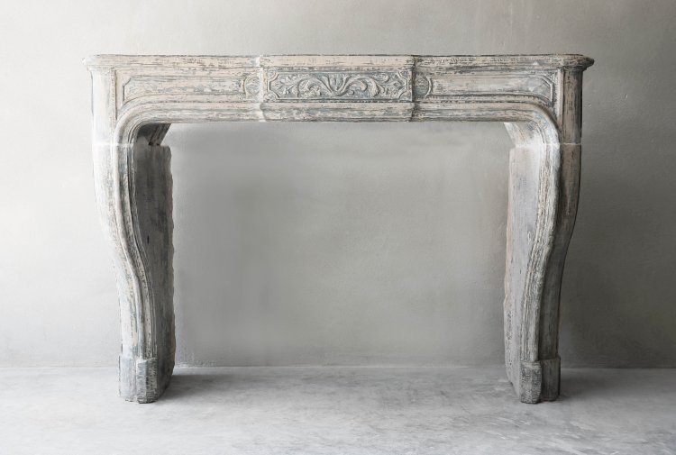 antique french limestone fireplace