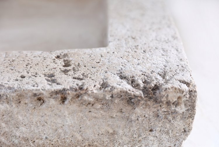 old sink of burgundy stone