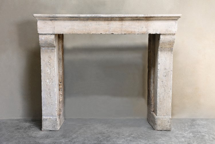 antique fireplace of french limestone