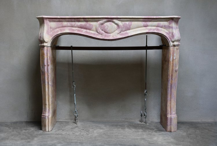 antique fireplace of marble stone