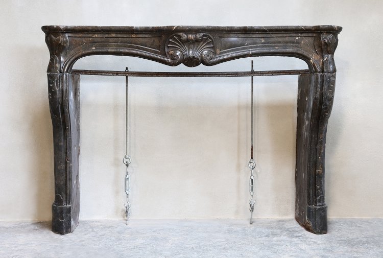 antique fireplace of marble stone