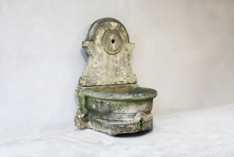 old french fountain of limestone
