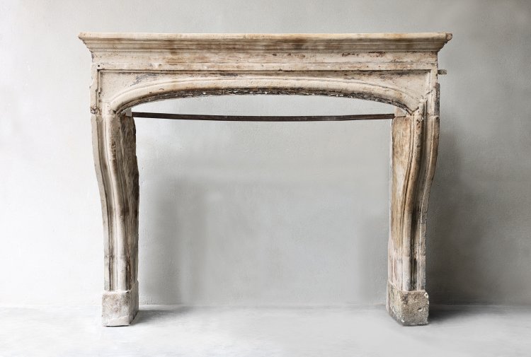 antique fireplace of french limestone