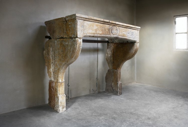 old french fireplace of limestone