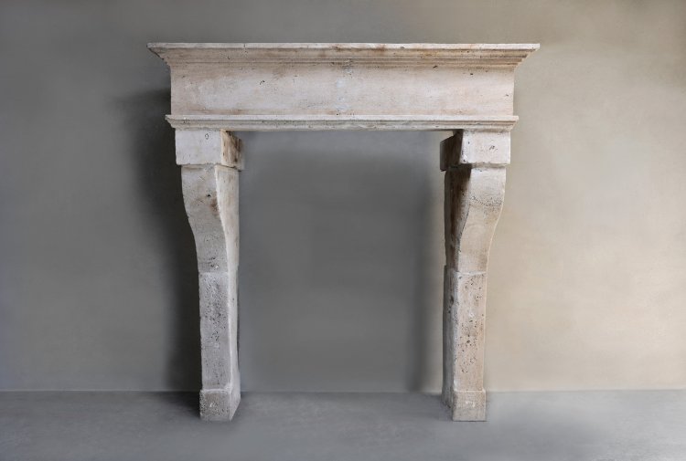 antique fireplace of french limestone
