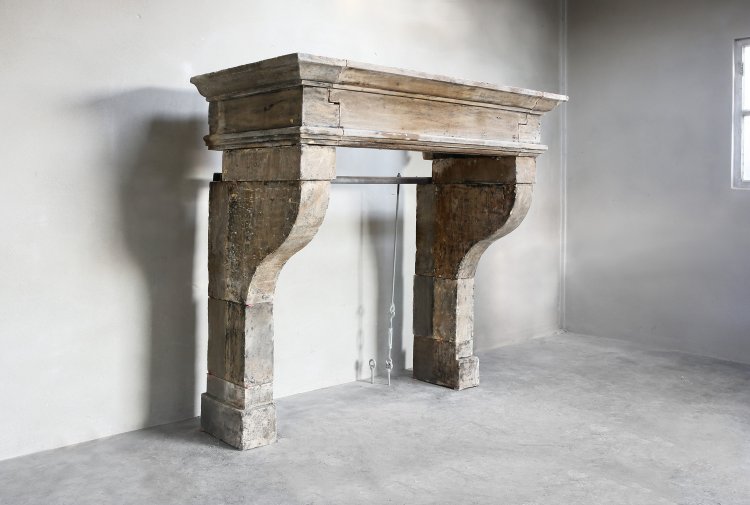 antique french fireplace of limestone