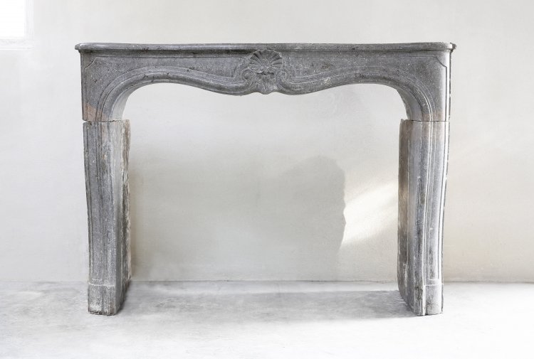 antique mantel of grey marble stone