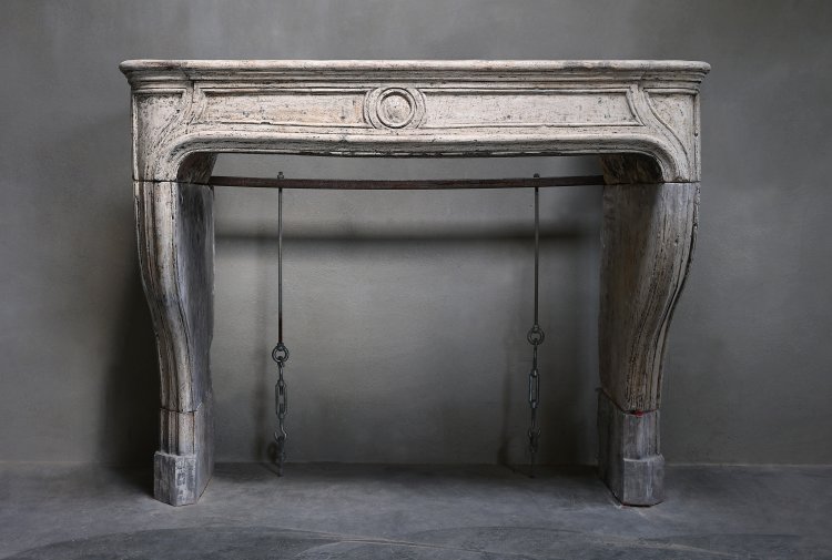 antique fireplace of french limestone