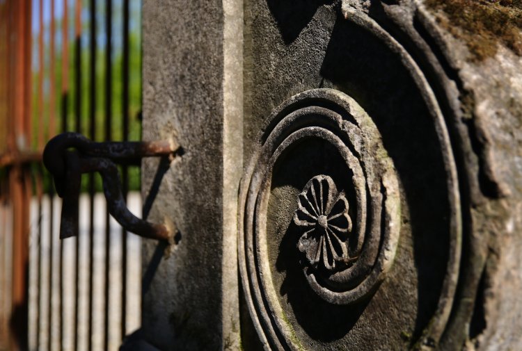 antique iron gate and limestone pilasters