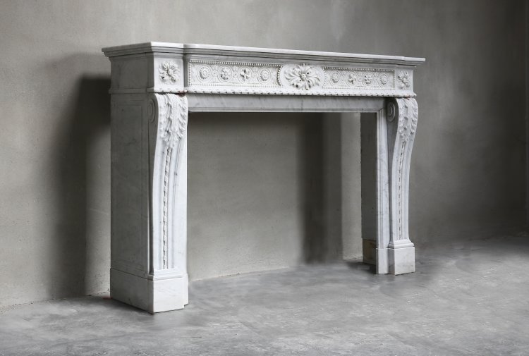 18th century fireplace of white marble