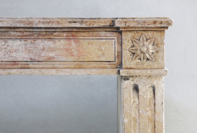 antique fireplace of marble stone