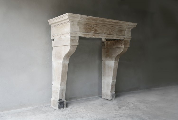 Antique french limestone fireplace