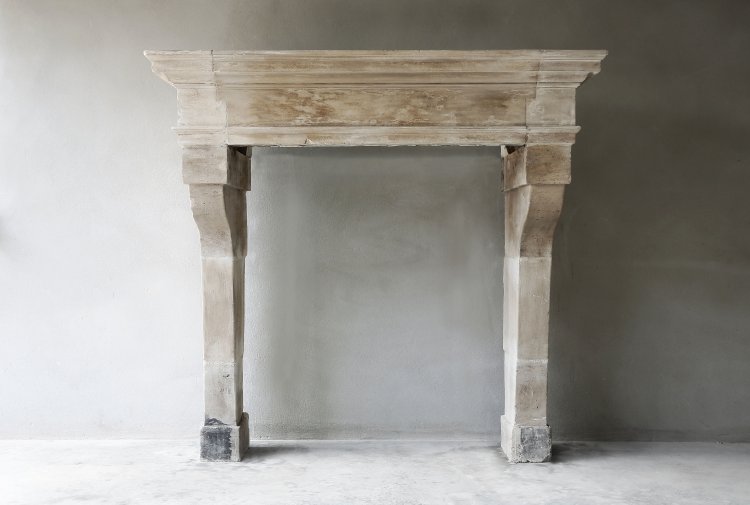 Antique french limestone fireplace