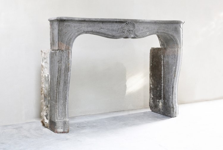 antique fireplace of marble stone