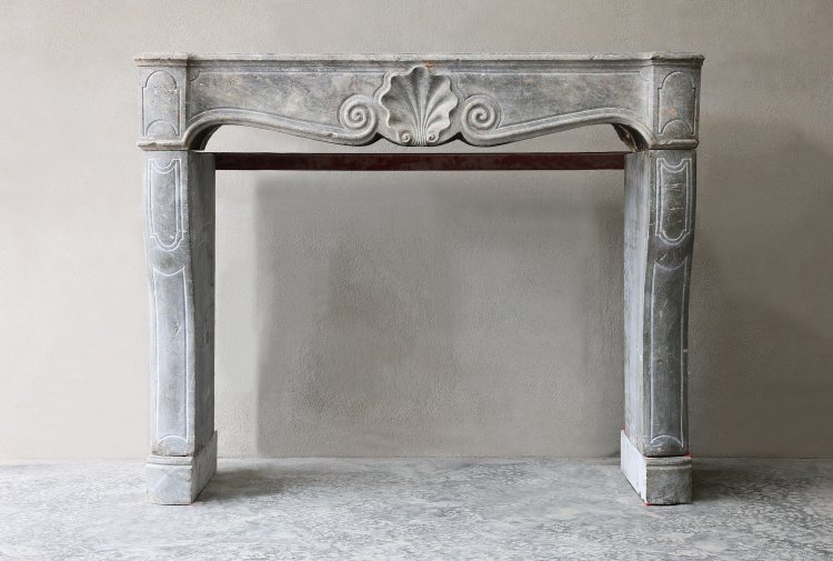 antique fireplace of marble stone