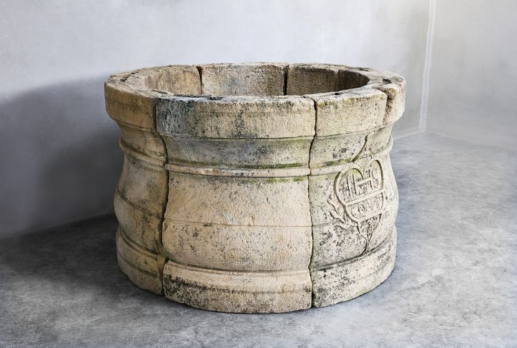 old french well of limestone
