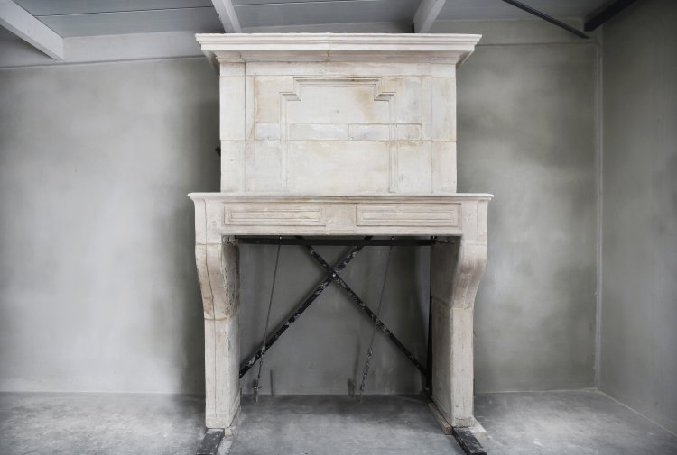 antique French fireplace of limestone