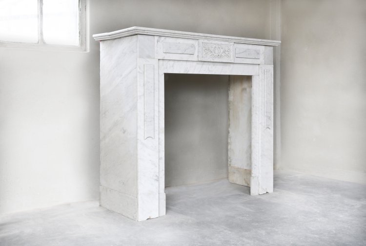 old antique fireplace of carrara marble