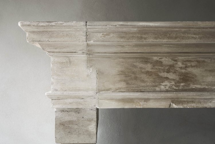 Antique french limestone fireplace