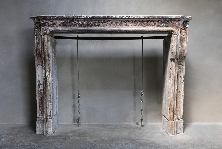 antique french limestone fireplace