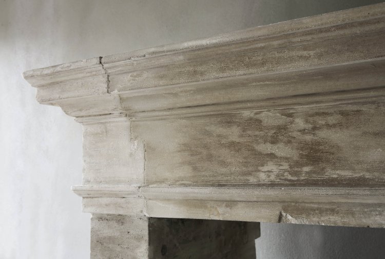 Antique french limestone fireplace