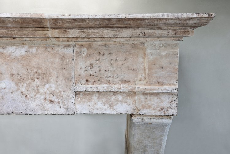 old mantle surround of french limestone