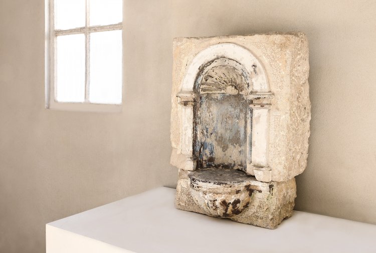 old french fountain of limestone