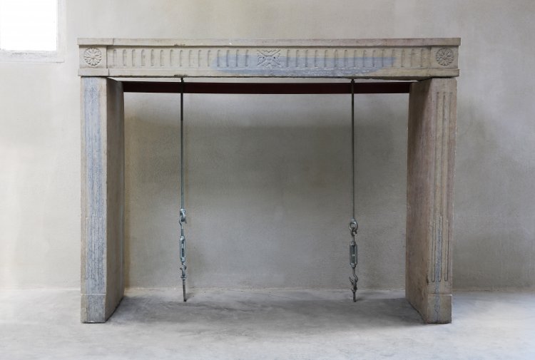 antique french fireplace of limestone