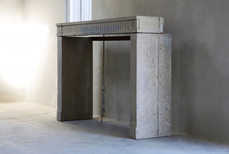 old fireplace of marble stone