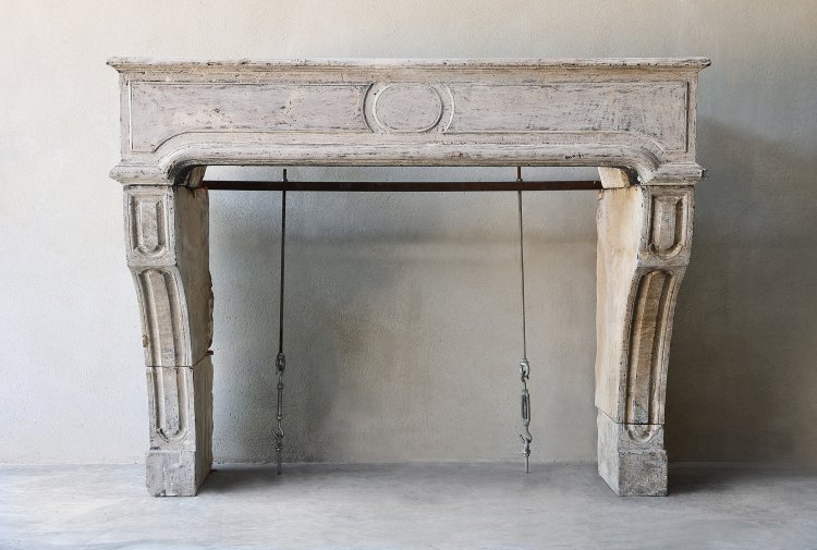 antique fireplace of limestone